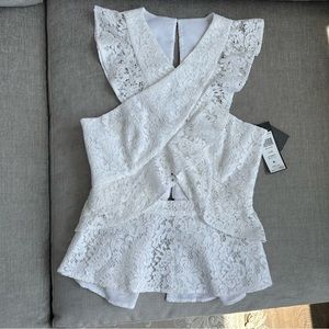 BCBG MaxAzria lace cut-out peplum top